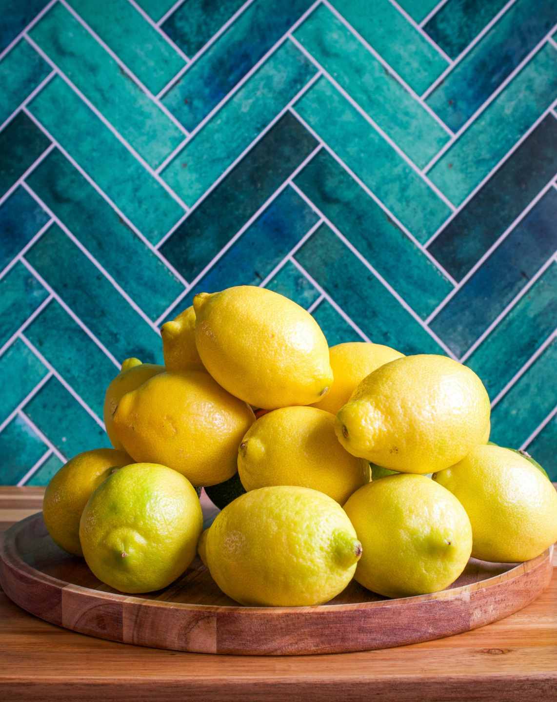 Bold colored patterned tile backsplash in kitchen